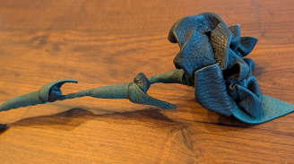 Black leather rose with green stem